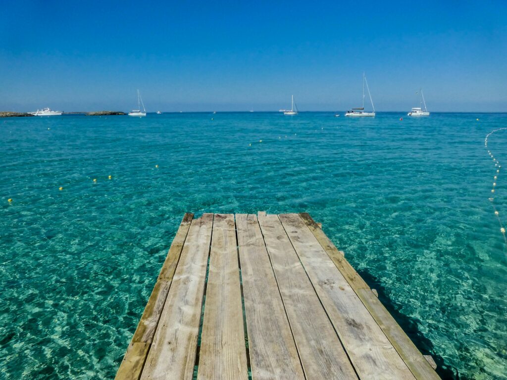 Jetty with clear blue water